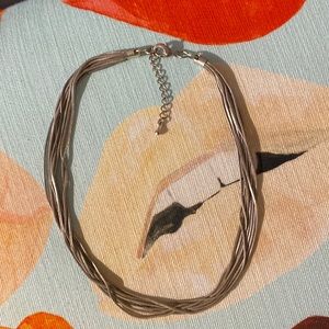 Silver multi strand necklace.